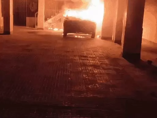 Car catches fire during charging in Ghaziabad:Smoke spreads in building, 15 escape by jumping to adjacent building
